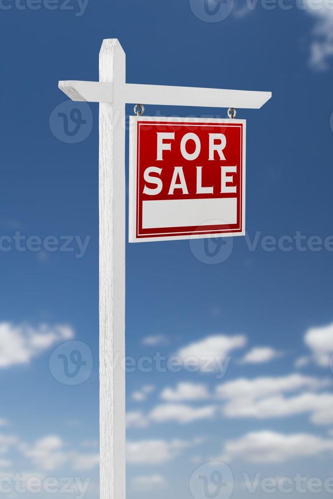 Right Facing For Sale Real Estate Sign on a Blue Sky with Clouds. photo