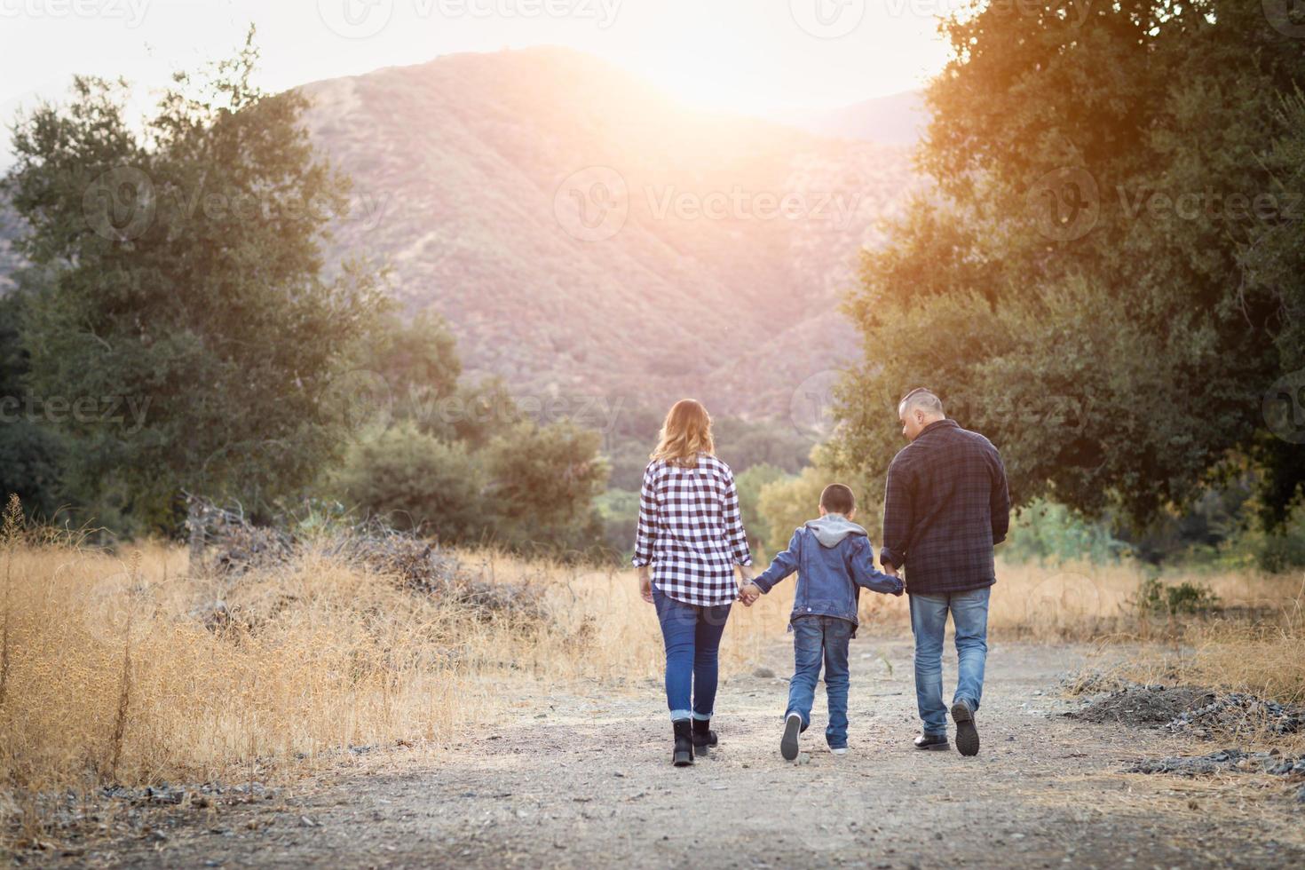 Mixed Race Family Taking A Walk Outdoors photo