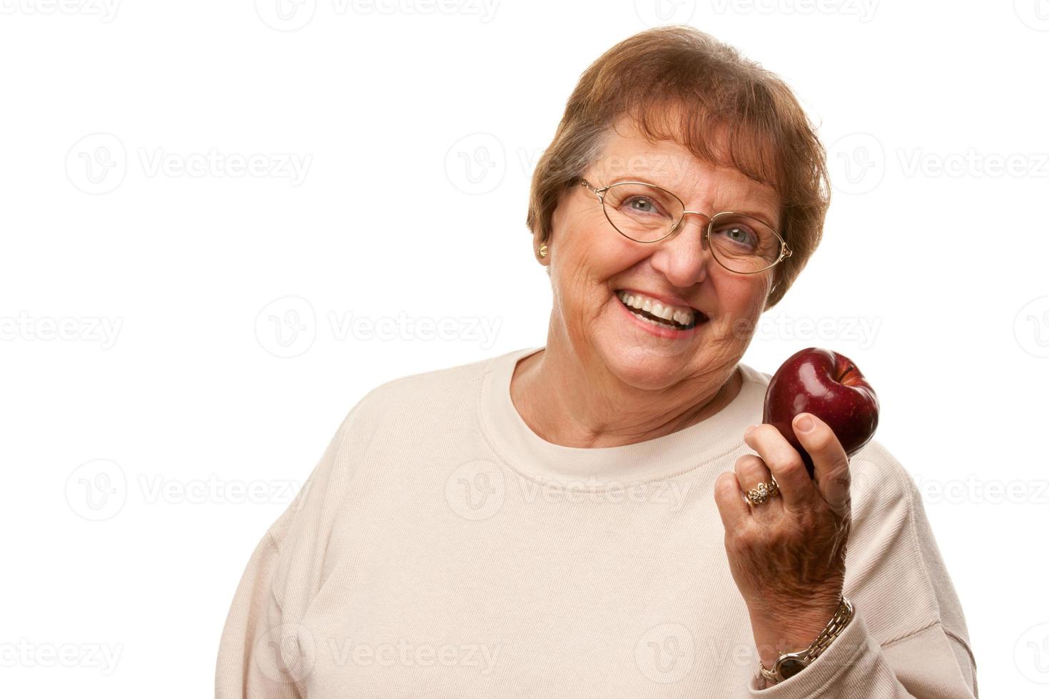 Attractive Senior Woman with Red Apple photo