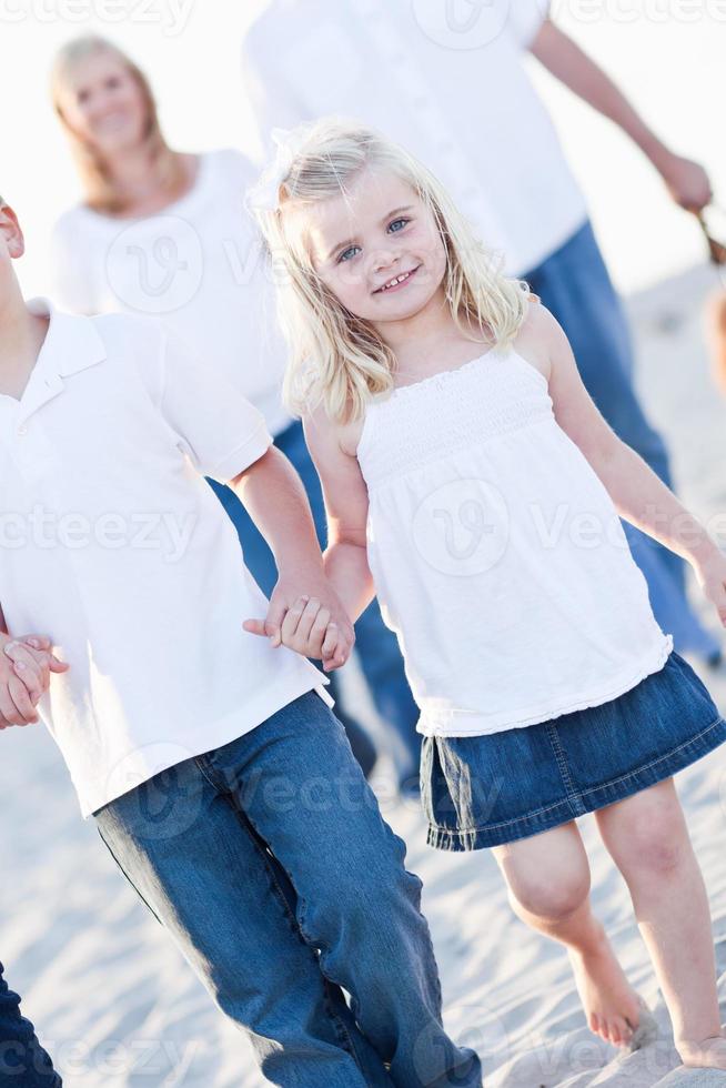 Adorable Little Girl Walking With Her Family photo