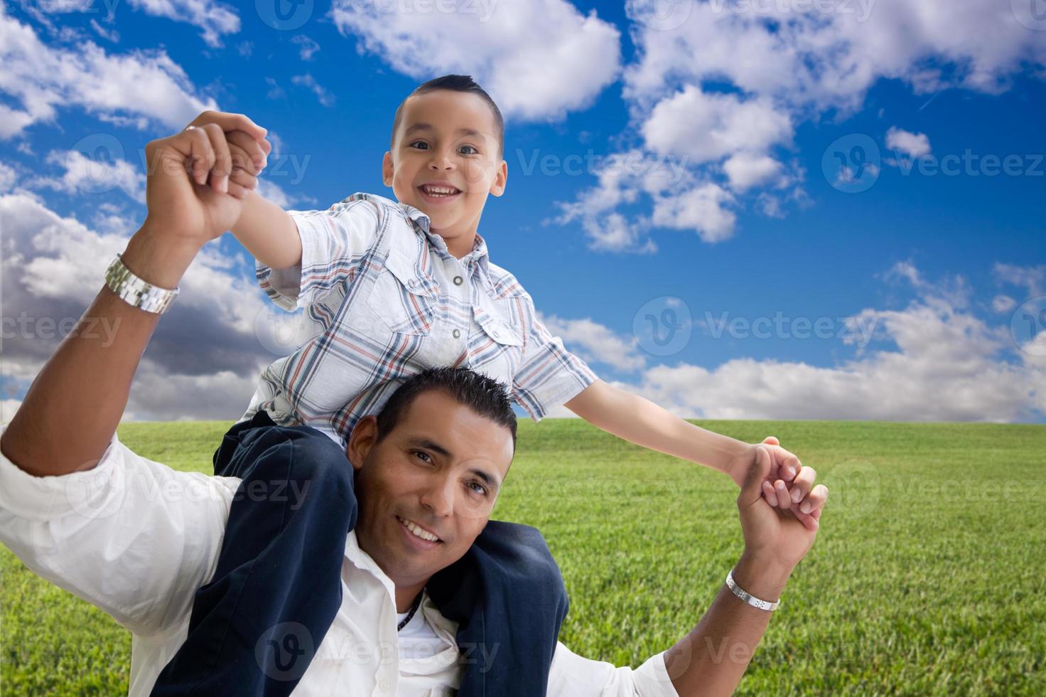 Father and Son Over Grass Field, Clouds and Sky photo