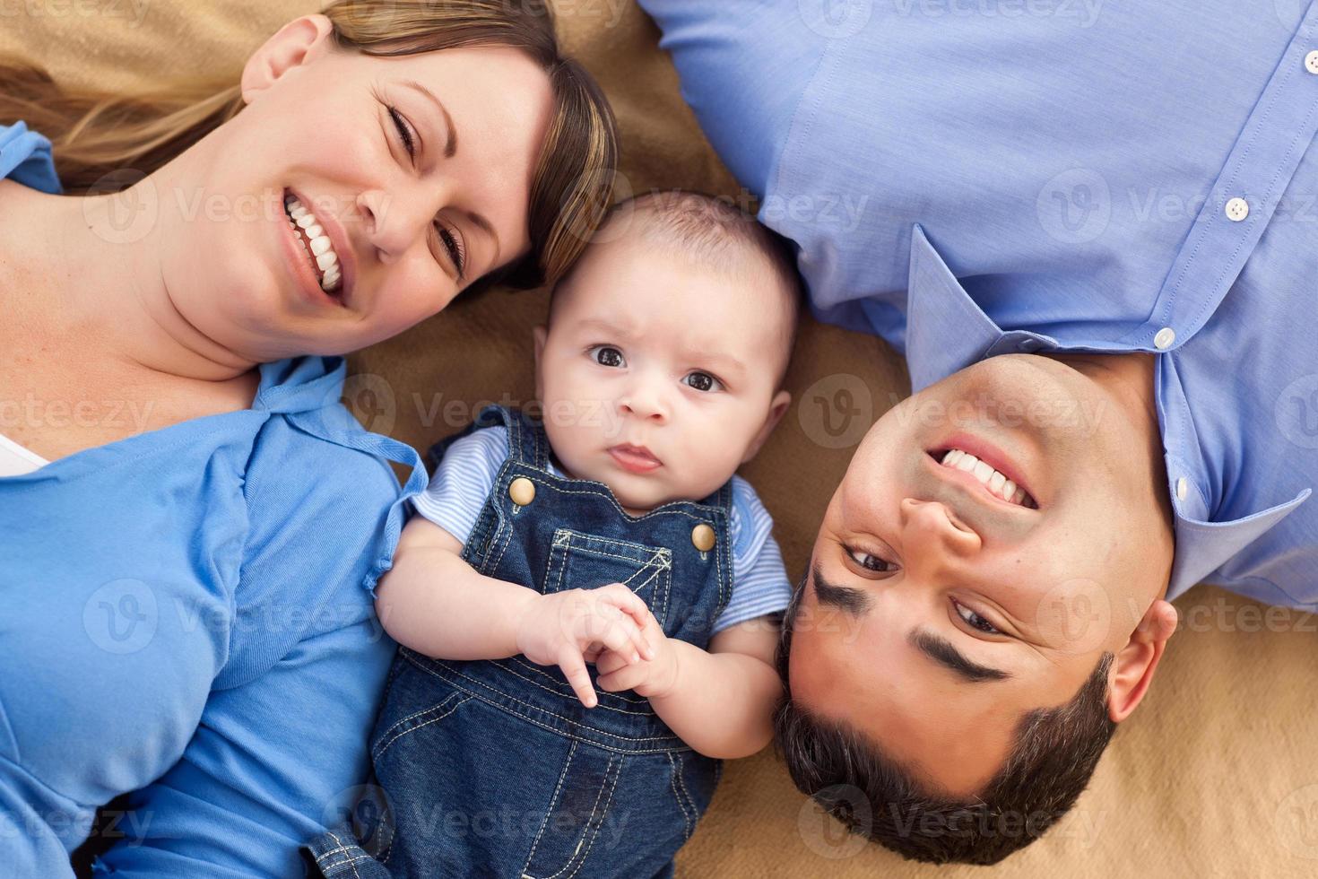 Mixed Race Family Playing on the Blanket photo