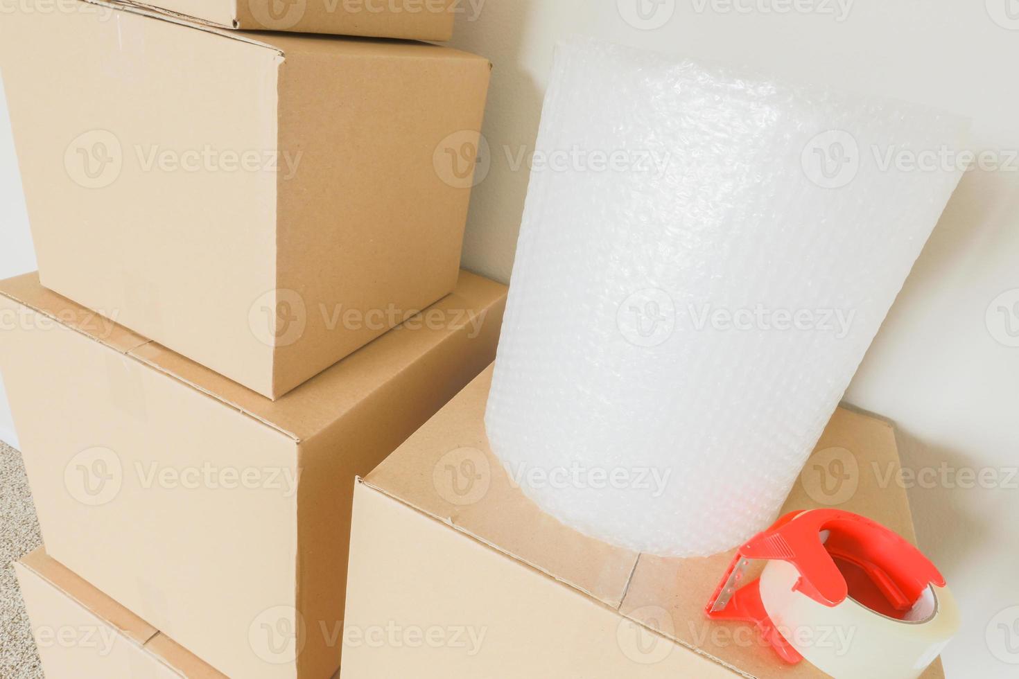 Variety of Packed Moving Boxes In Empty Room photo