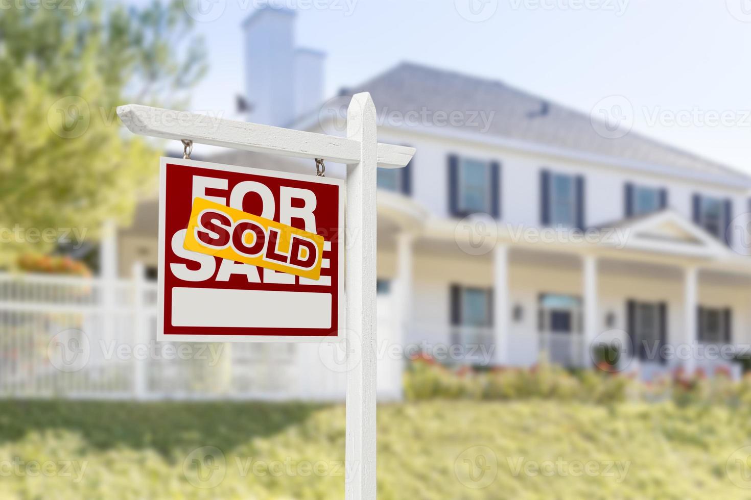 Sold Home For Sale Sign in Front of New House photo