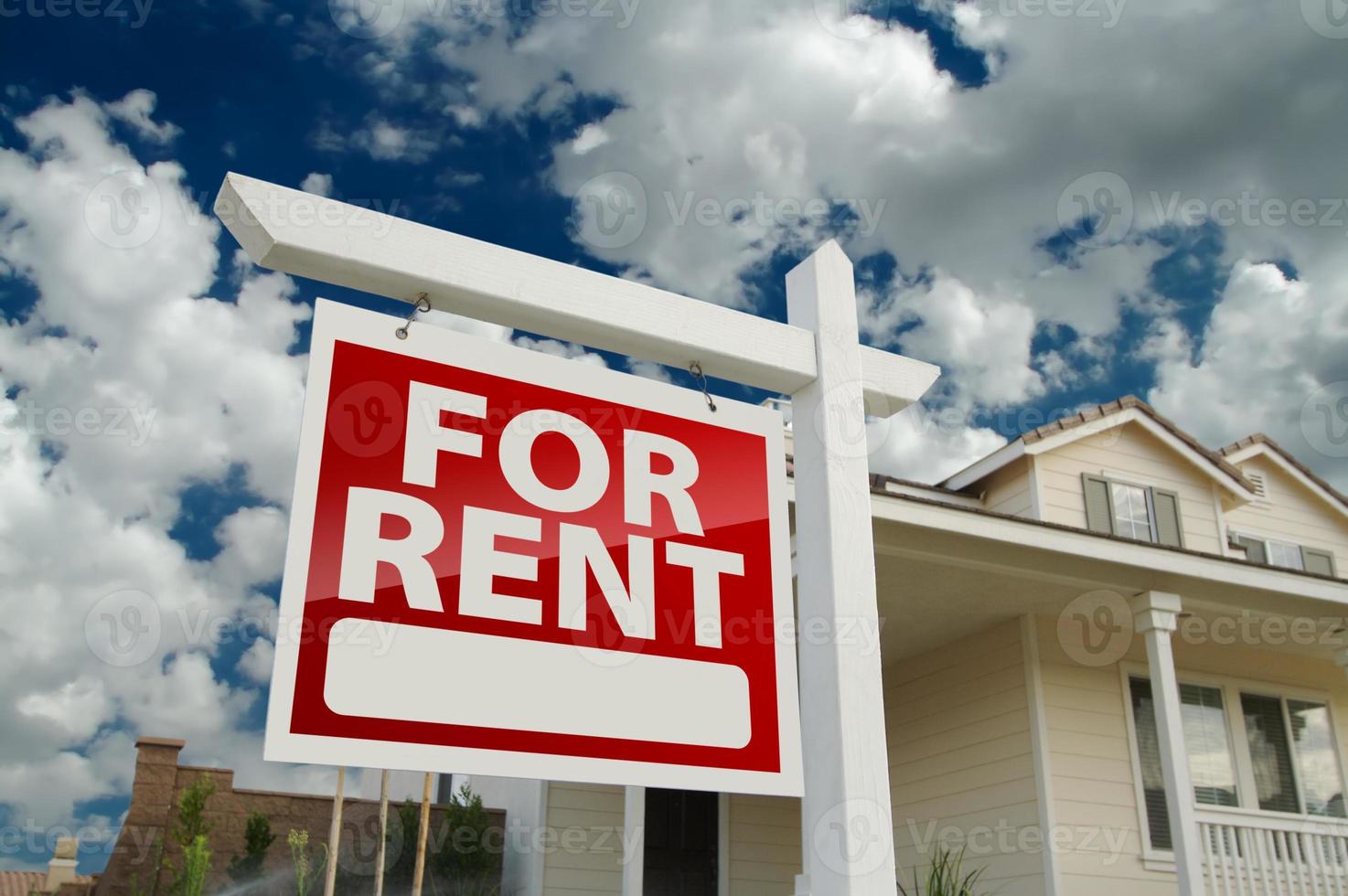 For Rent Real Estate Sign in Front of House photo