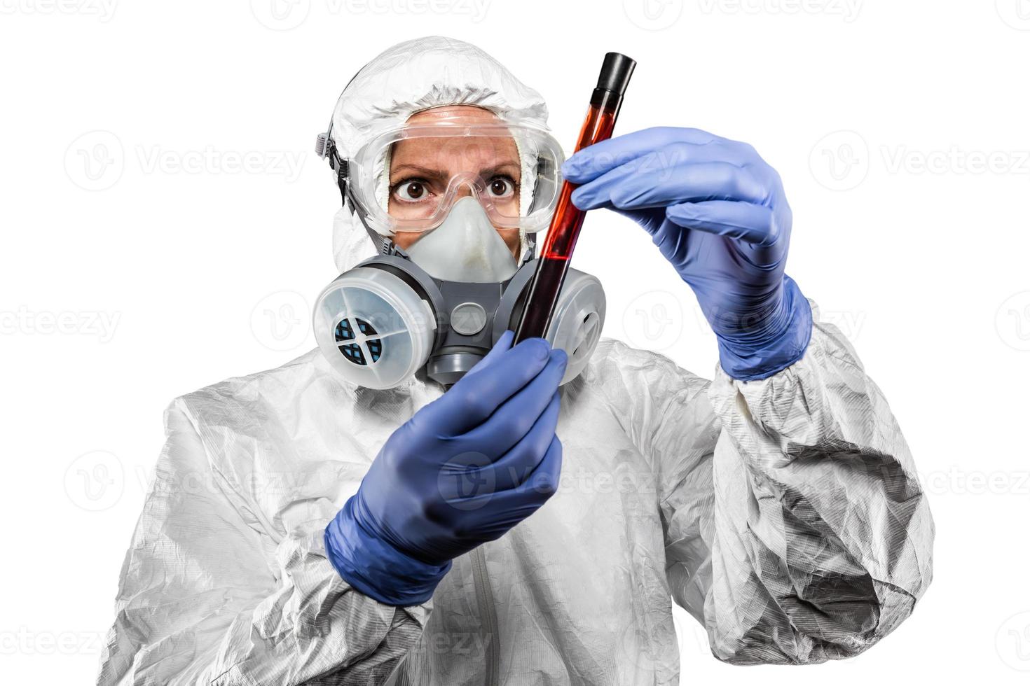 Woman In Hazmat Suit Holding Test Tube of Blood Isolated On White photo