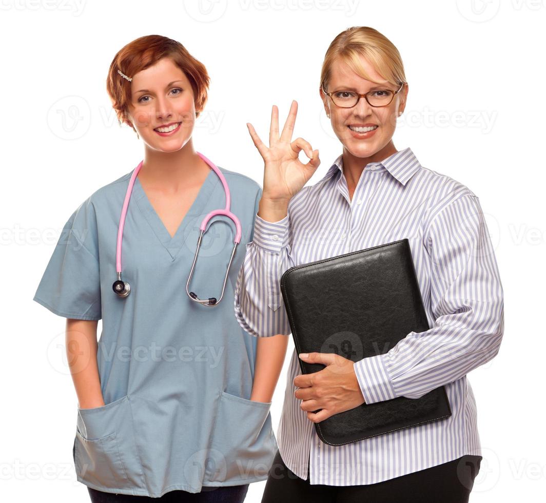 Businesswoman Making Okay Hand Sign with Doctor or Nurse photo