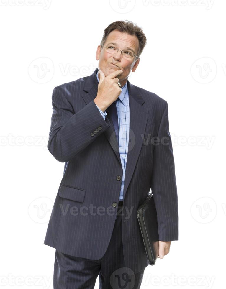 Businessman With Hand on Chin and Looking Up and Over photo