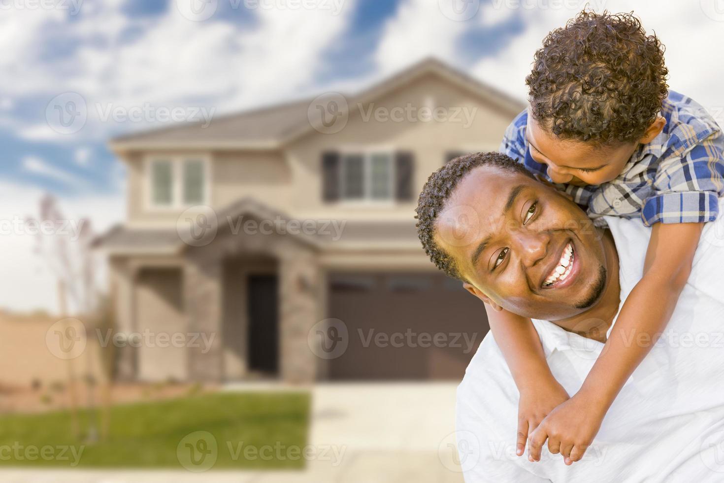 Mixed Race Father and Son In Front of House photo