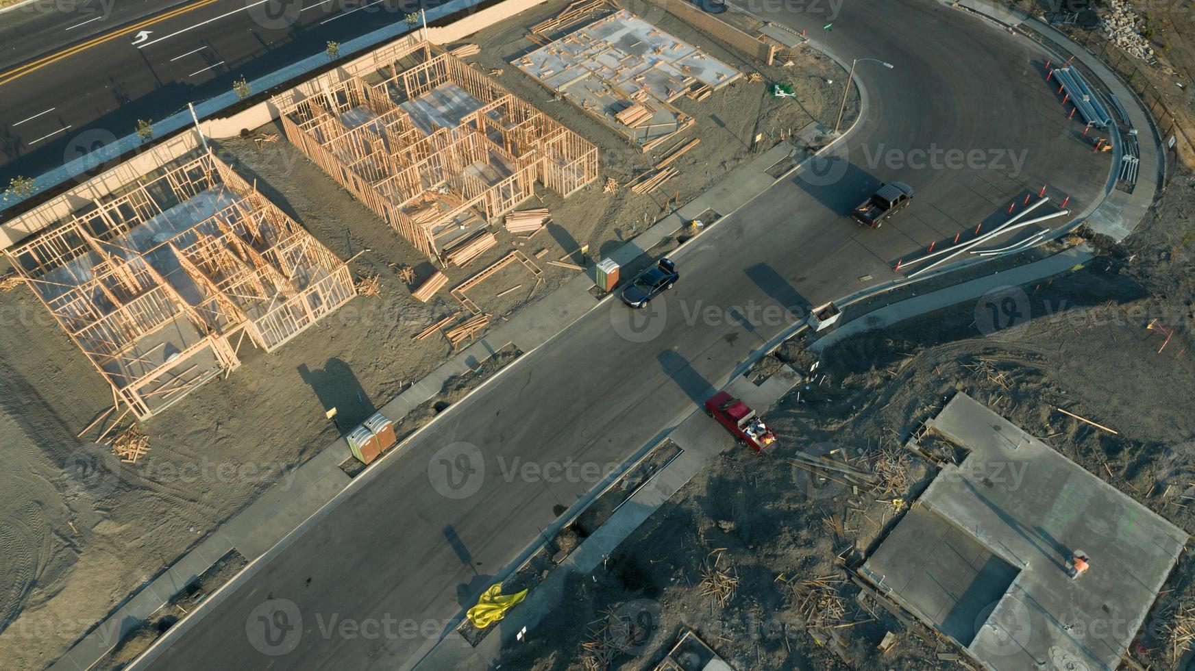 Drone Aerial View of Home Construction Site Foundations and Framing photo