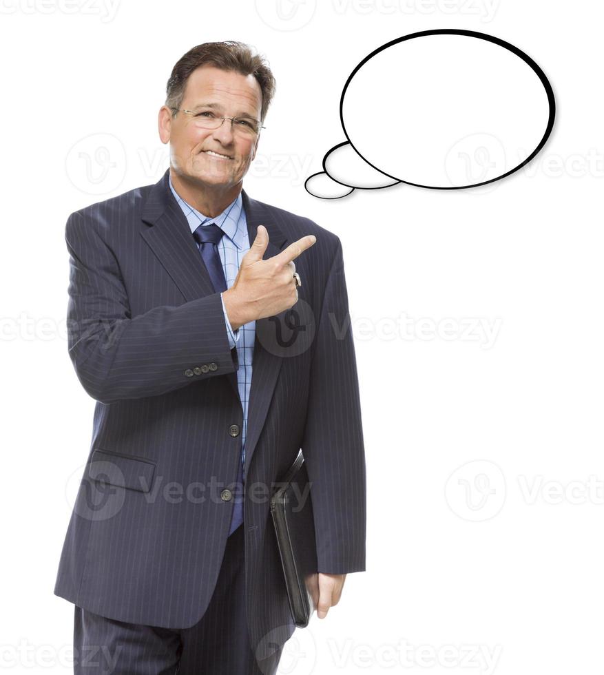 Businessman Pointing to the Blank Thought Bubble on White photo