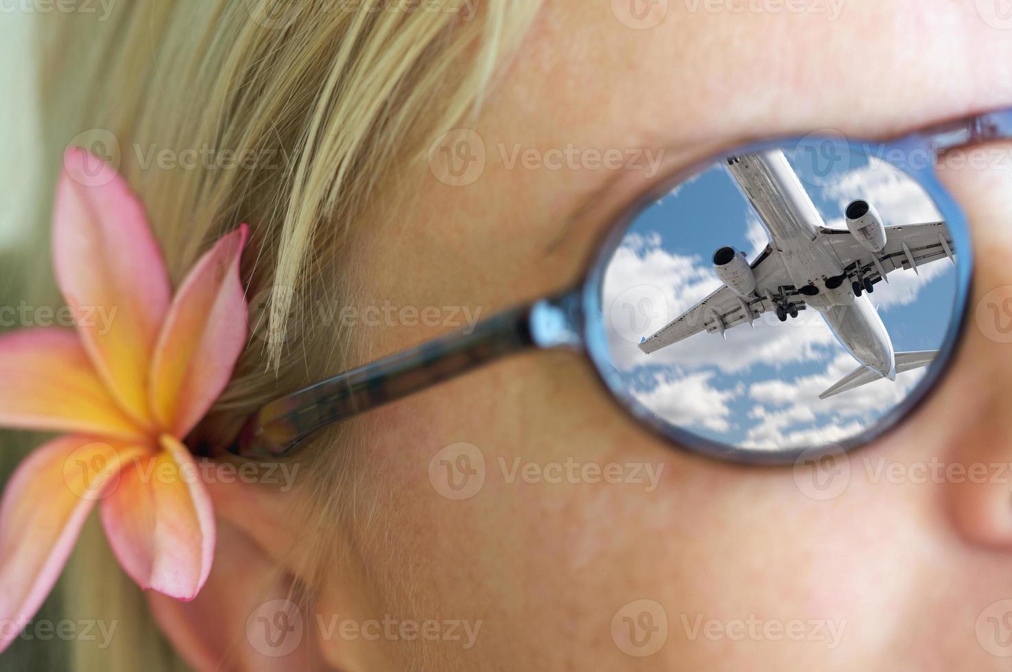 Girl Wearing Sunglasses, Plumeria Flower In Hair and Reflection photo