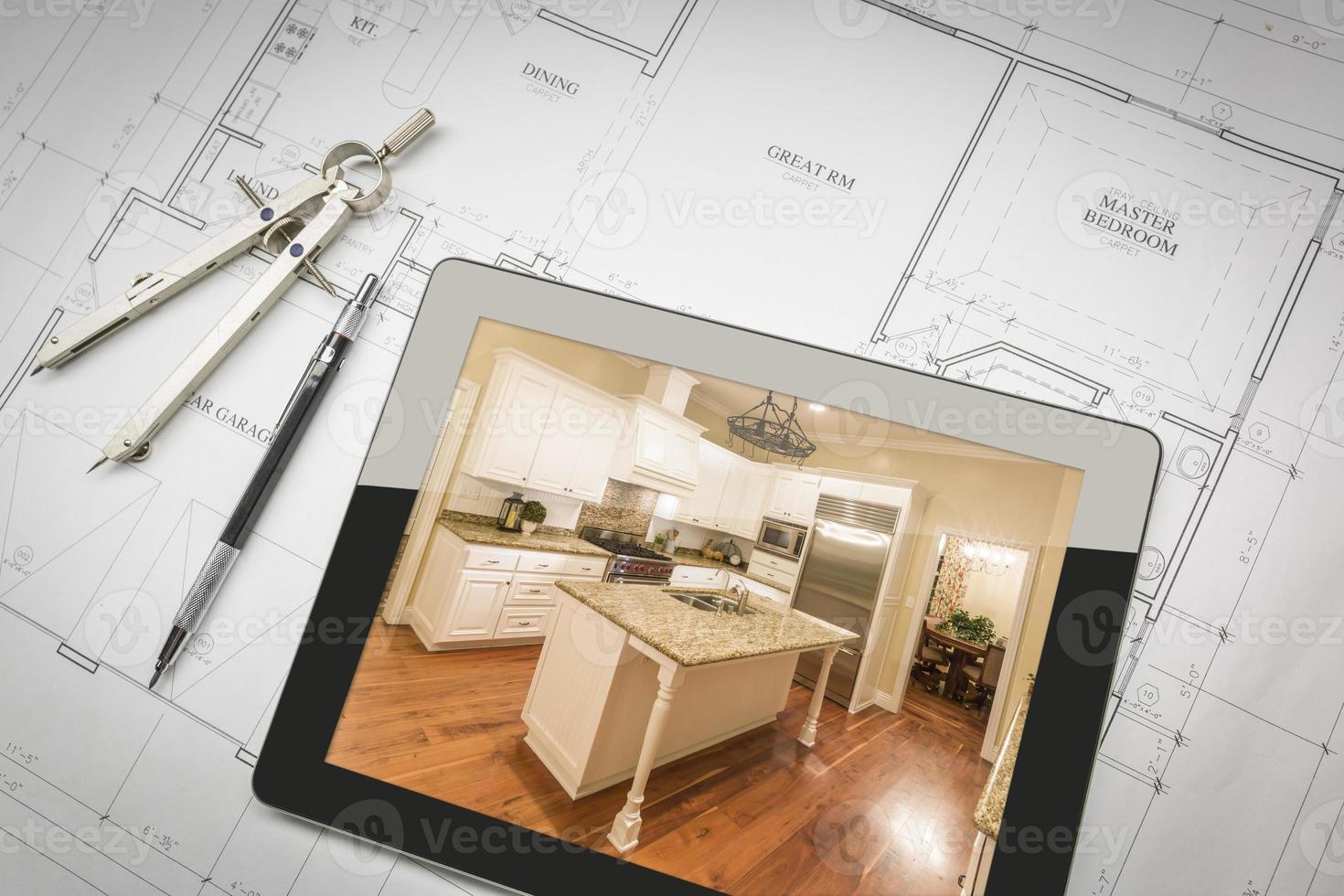 Computer Tablet Showing Finished Kitchen On House Plans, Pencil, Compass photo