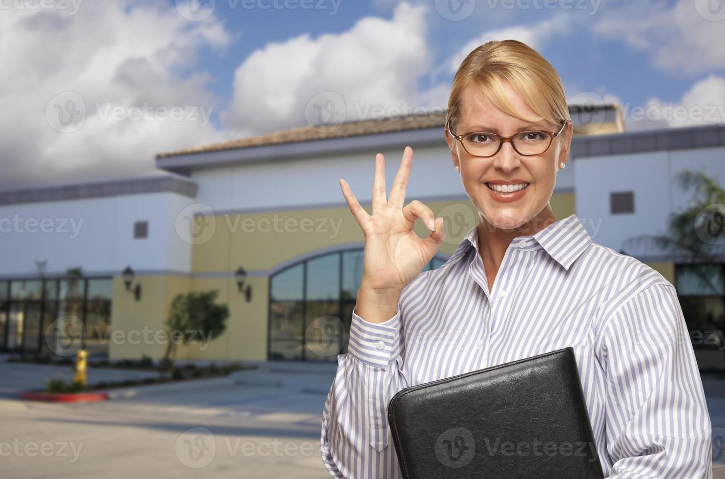 Businesswoman In Front of Vacant Office Building photo