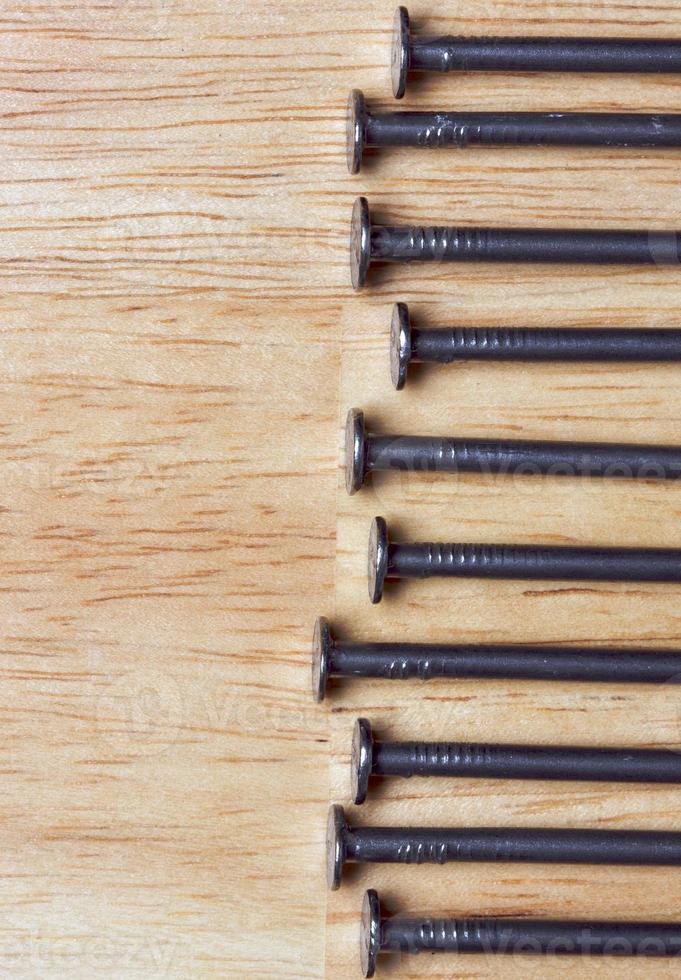 Macro of Nails on Wood photo