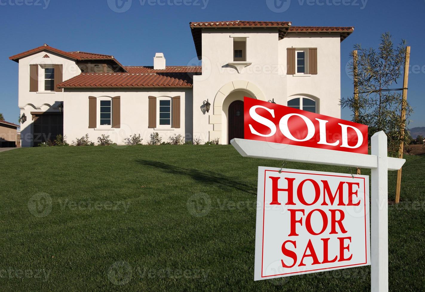 Sold Home For Sale Sign and New House photo