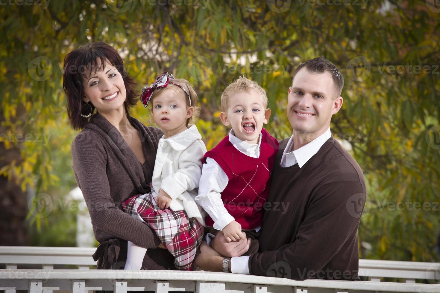 Young Attractive Parents and Children Portrait in Park photo