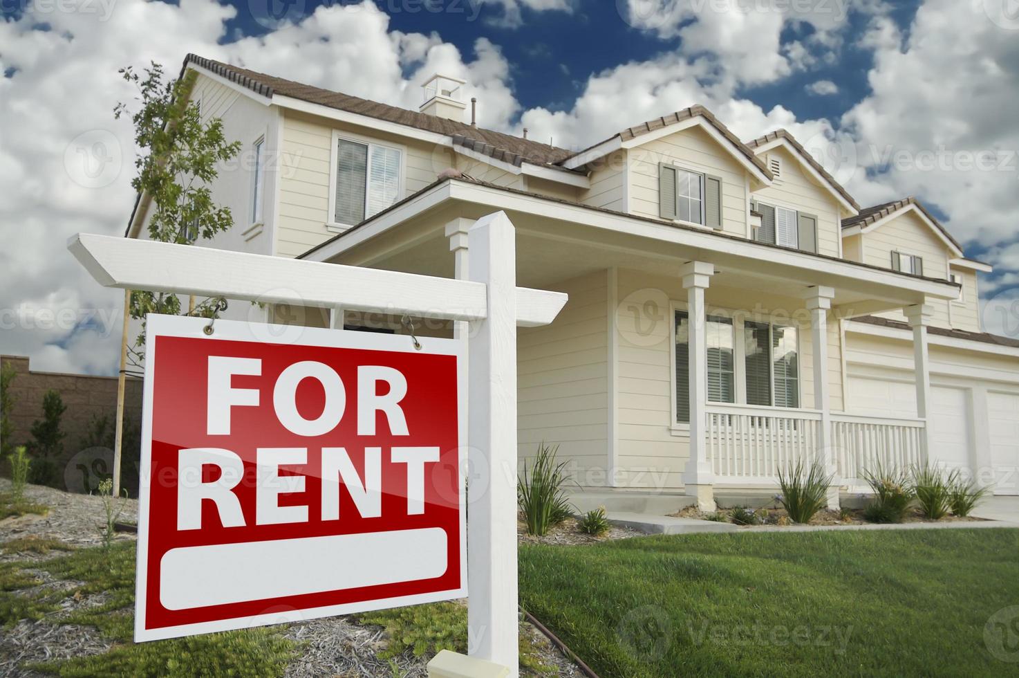 For Rent Real Estate Sign in Front of House photo