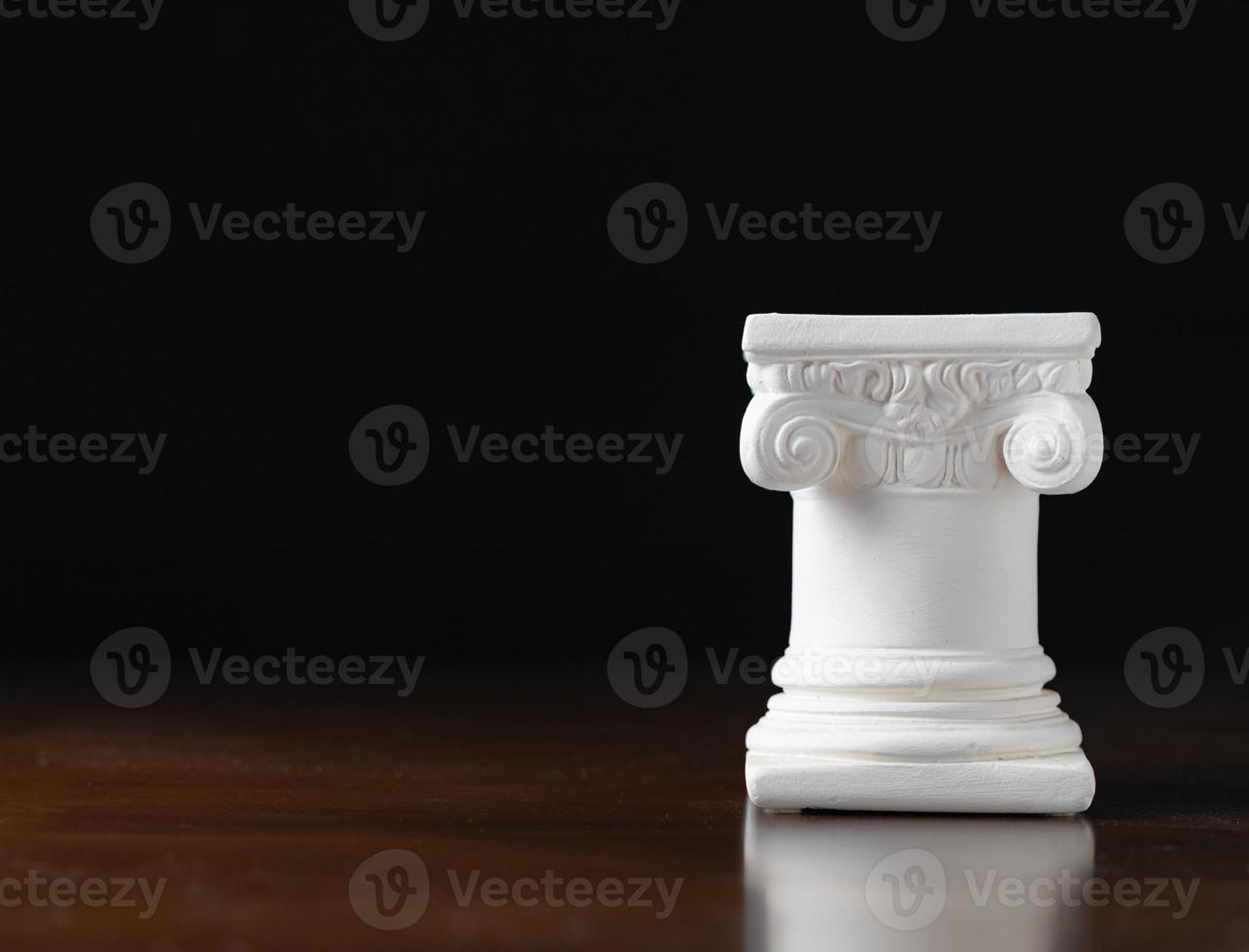 White Ionic Design Column on Dark Background photo