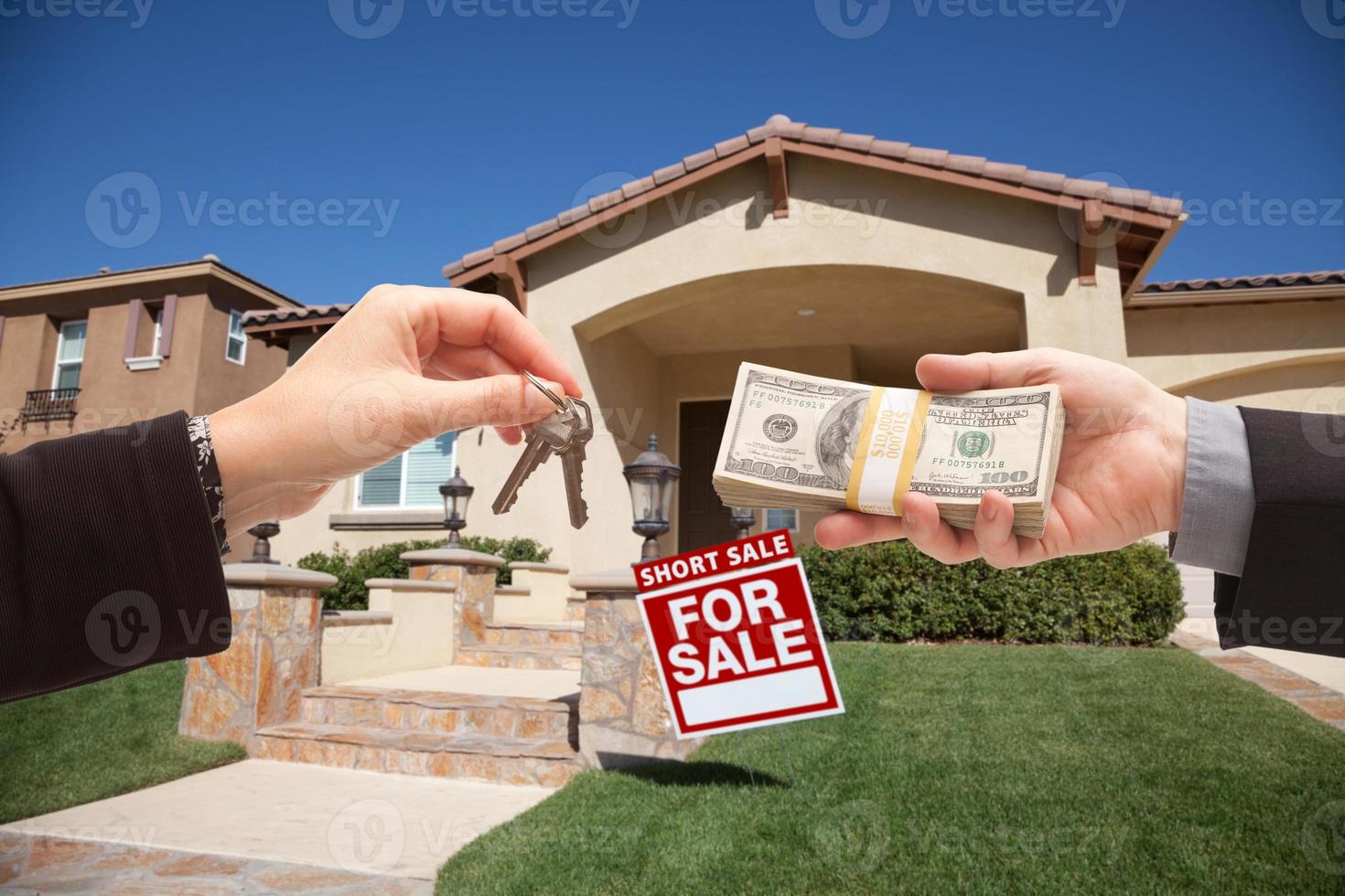 Handing Over Cash For House Keys and Short Sale Sign photo