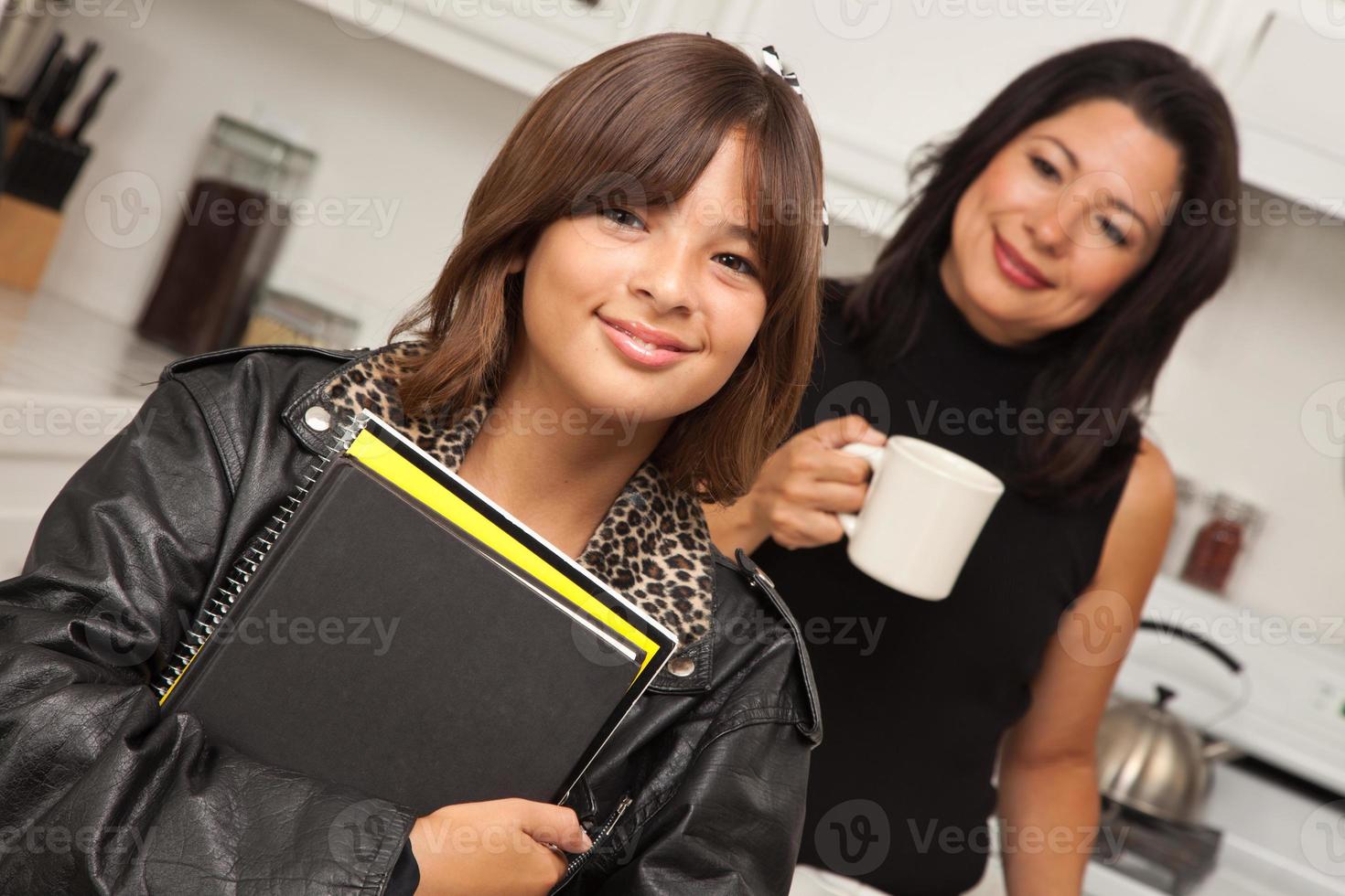 Pretty Hispanic Girl Ready for School with Mom photo