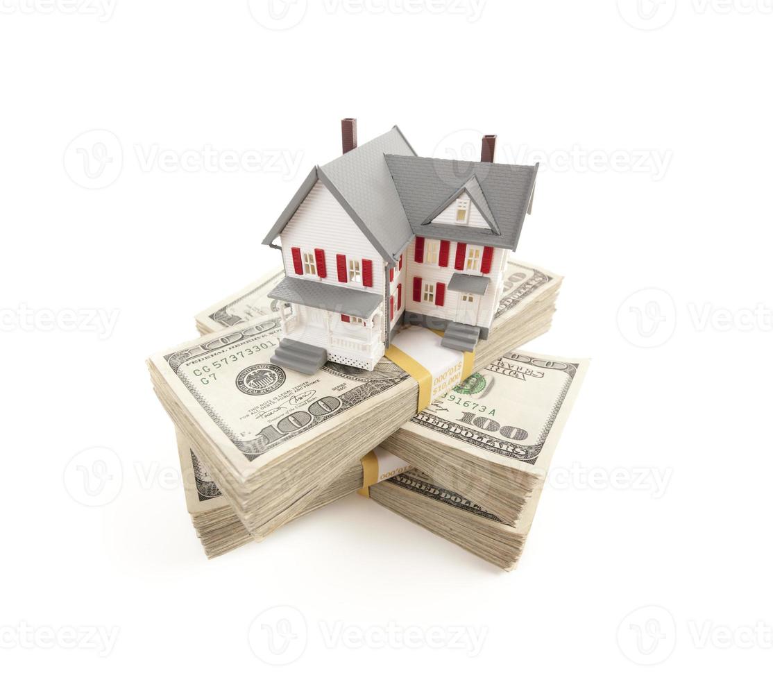 Small House on Stacks of Hundred Dollar Bills photo