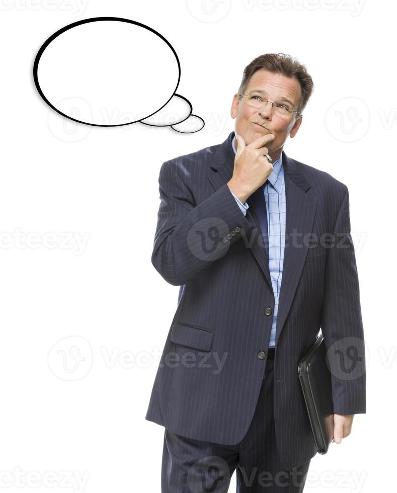 Pensive Businessman Looking Up At Blank Thought Bubble photo