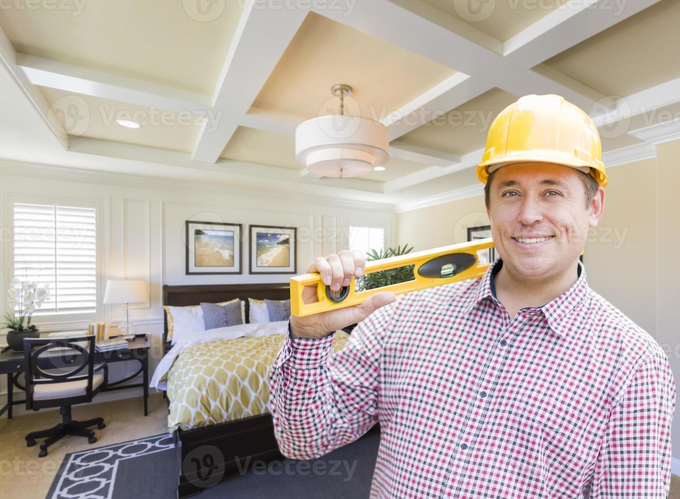 Contractor in Hard Hat Over Custom Bedroom Drawing and Photo