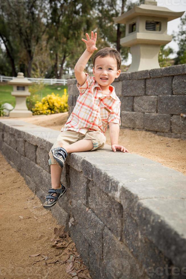 Young Chinese and Caucasian Boy Having Fun at the Park. photo