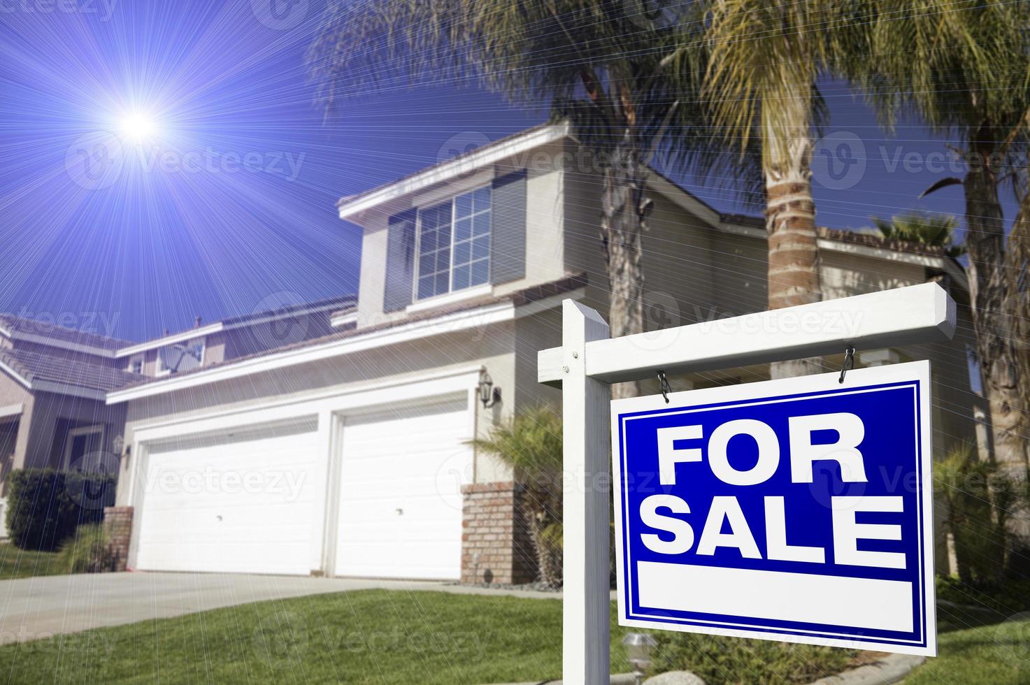 Blue For Sale Real Estate Sign and House photo