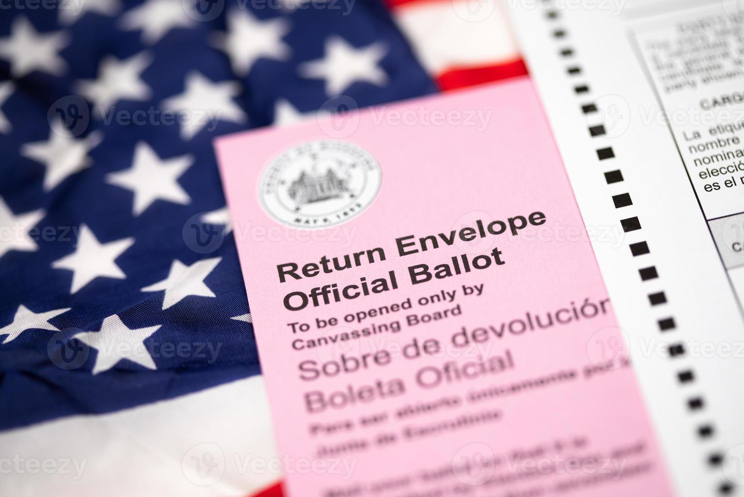 Vote-By-Mail Ballot Envelope Laying on American Flag photo