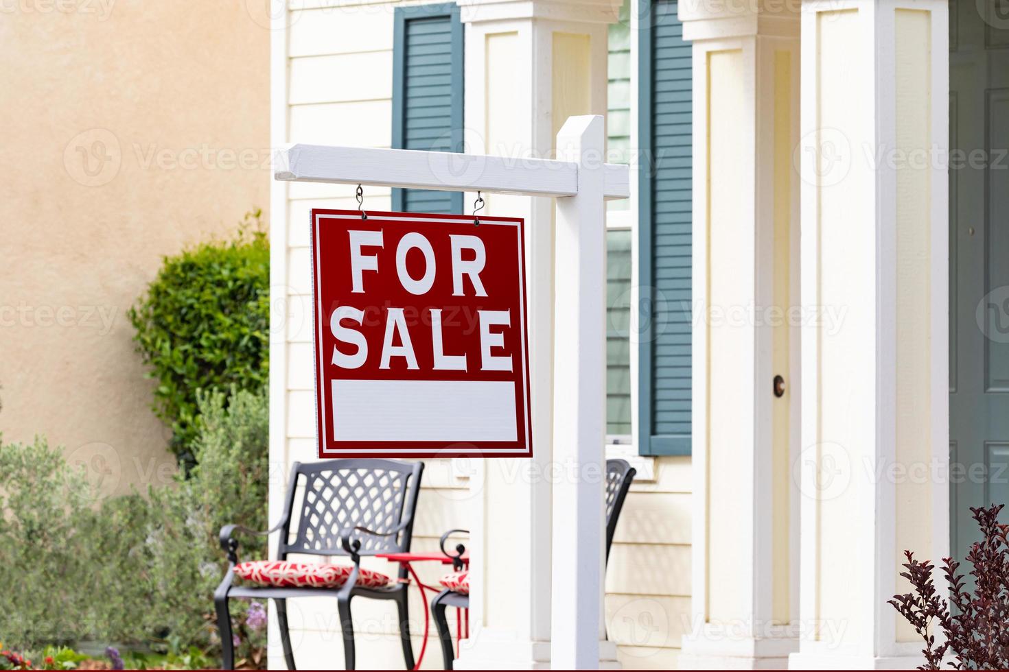 Home For Sale Real Estate Sign in Front of New House photo