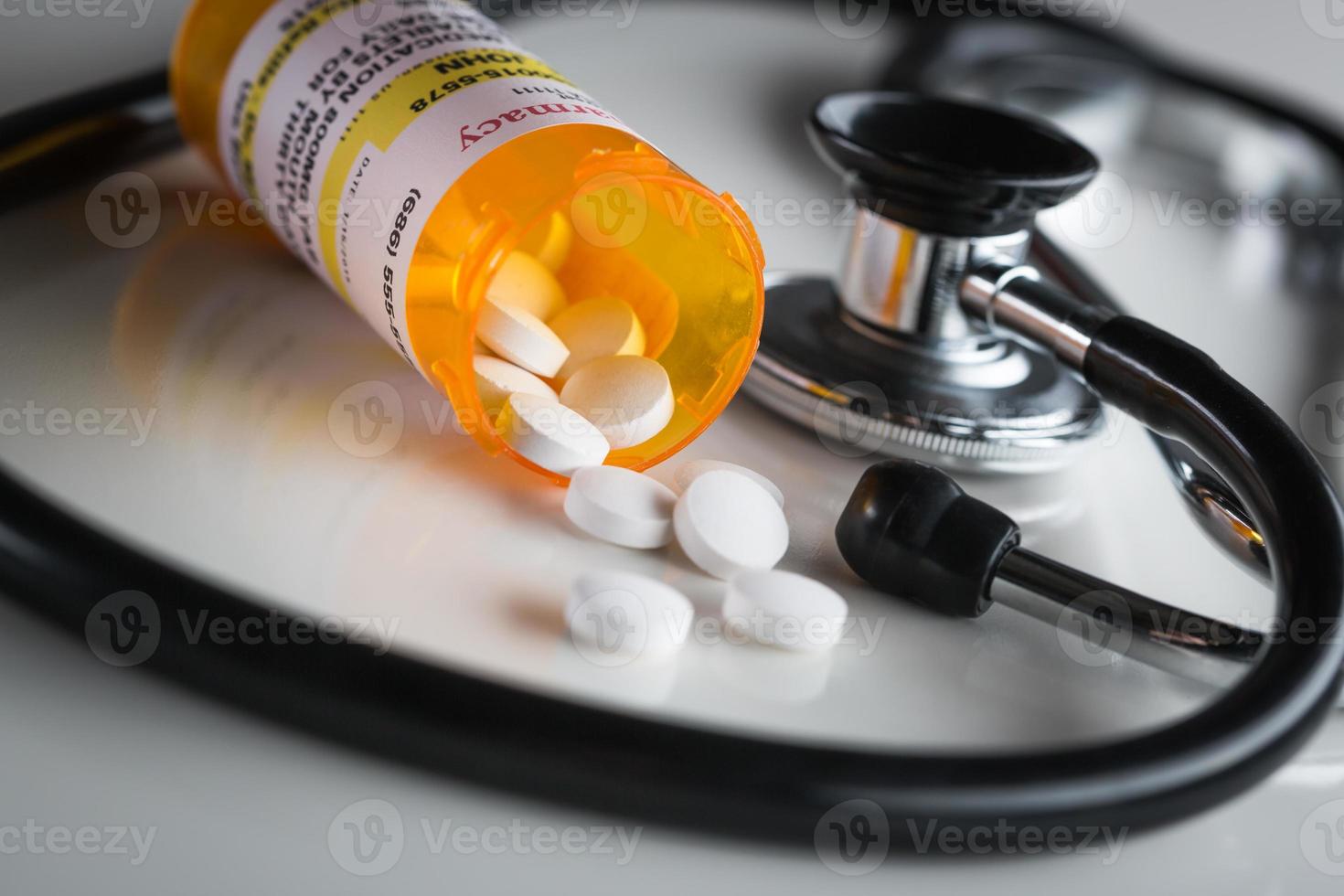 Non-Proprietary Medicine Prescription Bottles and Spilled Pills with Stethoscope photo