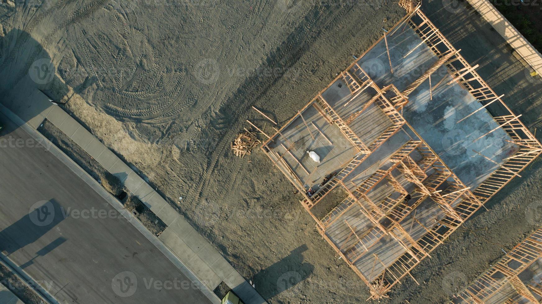 Drone Aerial View of Home Construction Site Foundations and Framing photo