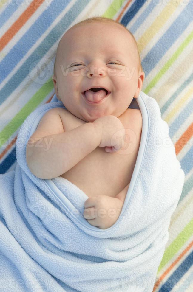Laughing Baby Boy Wrapped in His Blanket photo