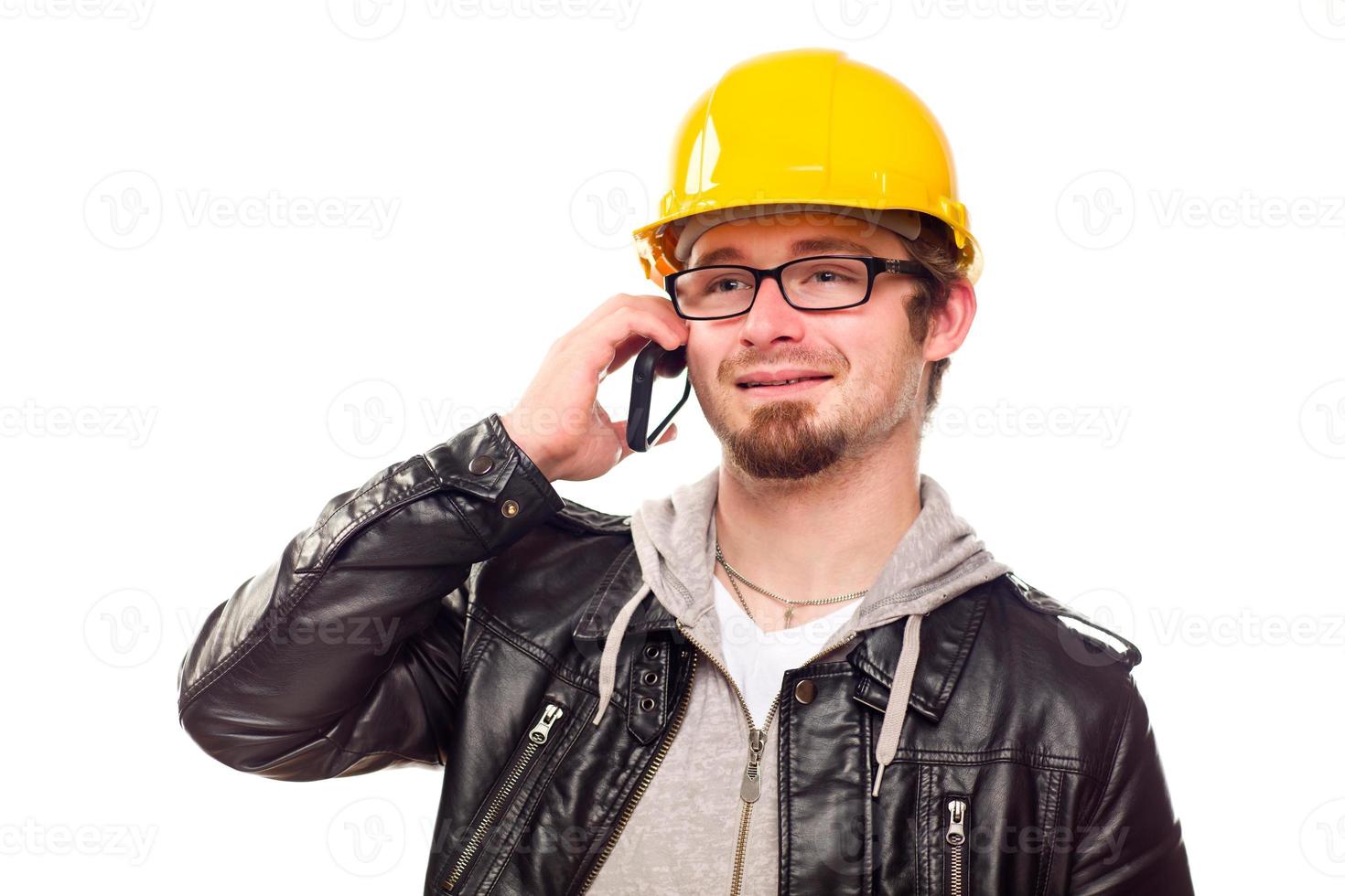 Handsome Young Man in Hard Hat on Phone photo