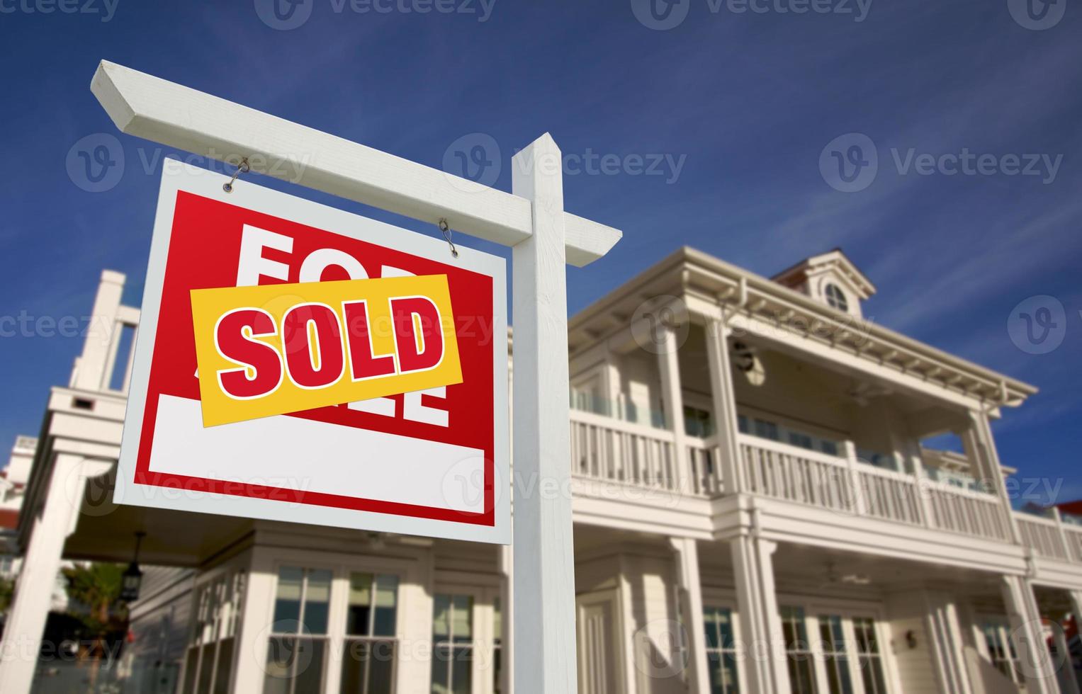 Sold Home For Sale Sign in Front of New House photo