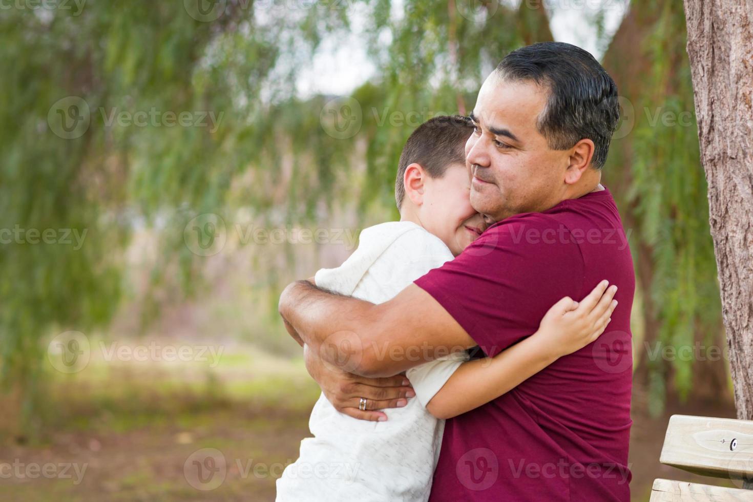 Mixed Race Hispanic and Caucasian Son and Father Having Fun At The Park photo