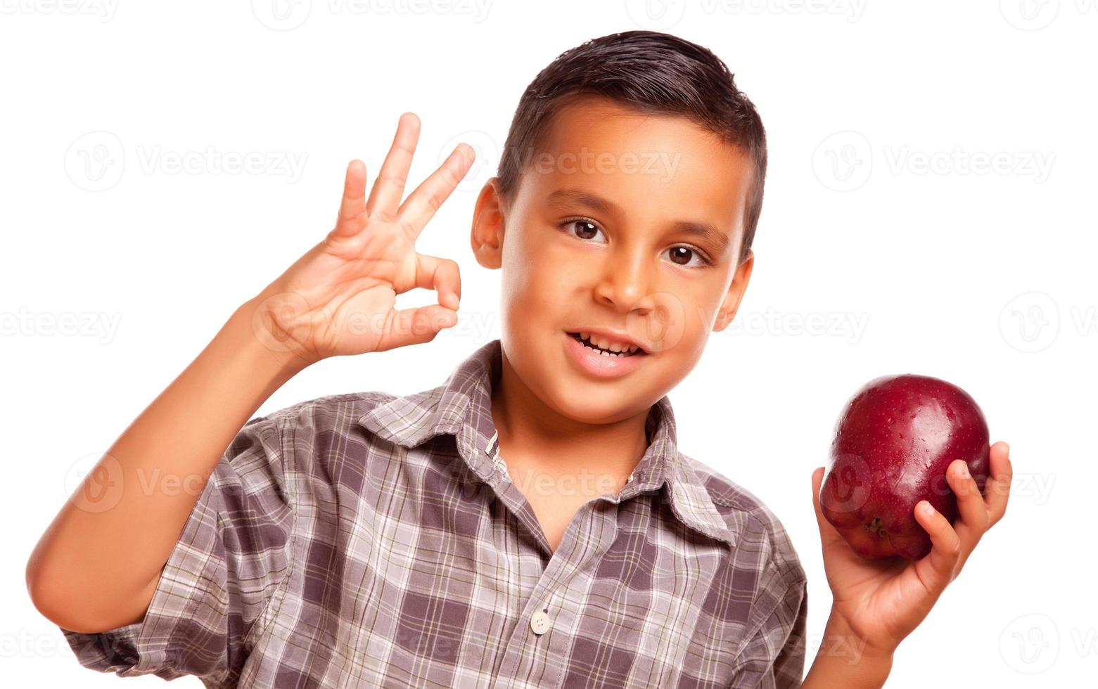 Adorable Hispanic Boy with Apple and Okay Hand Sign photo