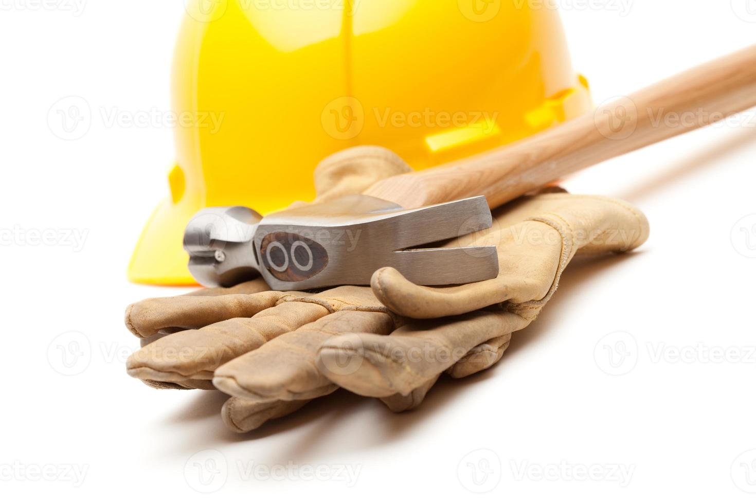 Yellow Hard Hat, Gloves and Hammer on White photo