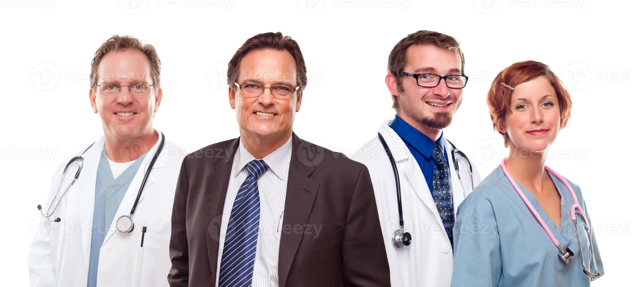 Smiling Businessman with Doctors and Nurses photo