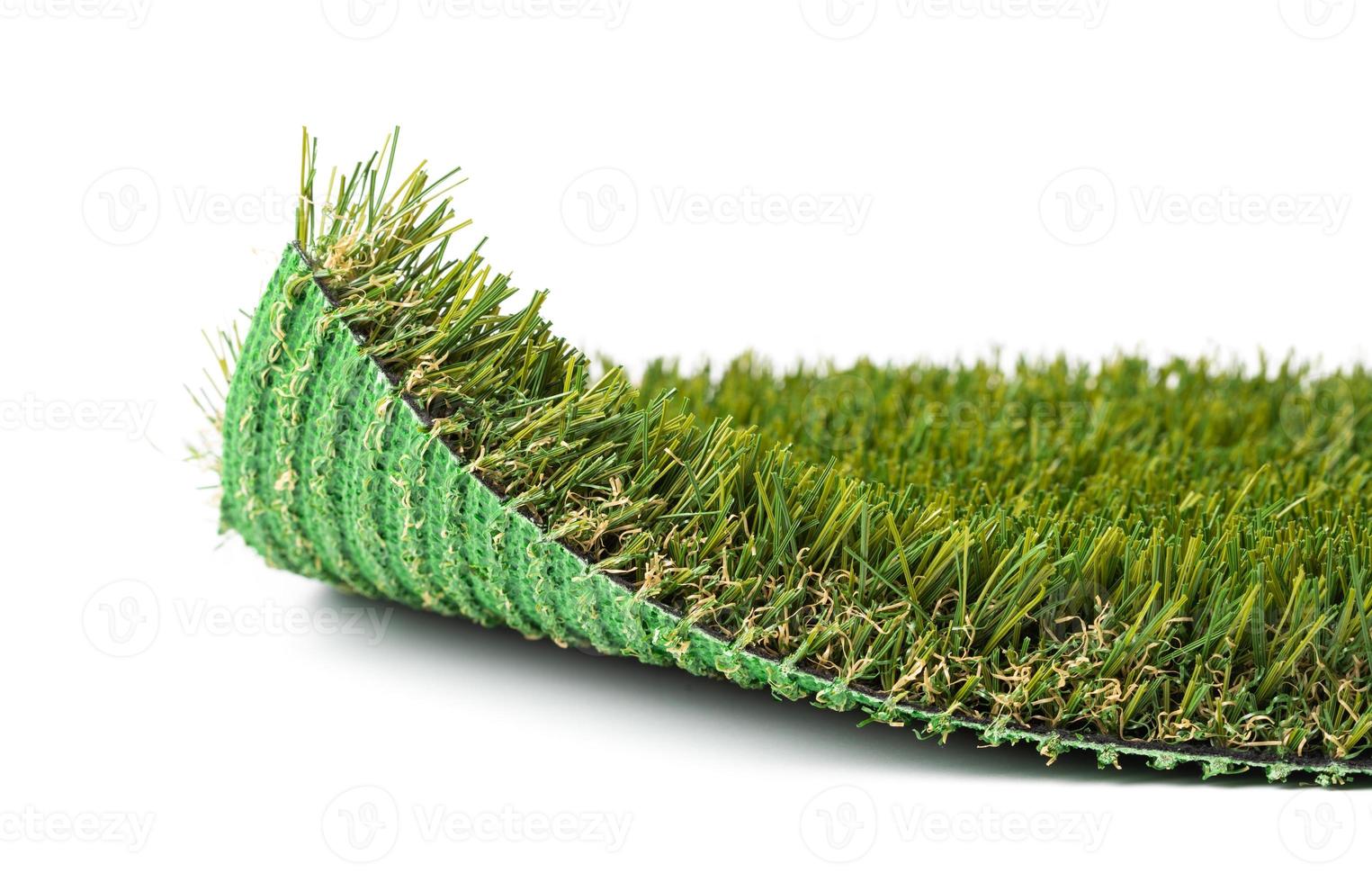 Flipped Up Section of Artificial Turf Grass On White Background photo