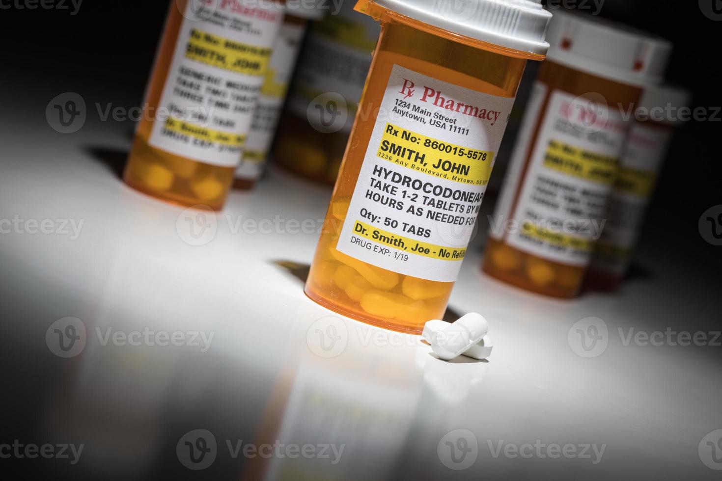 Hydrocodone Pills and Prescription Bottles with Non Proprietary Label. No model release required - contains fictitious information. photo