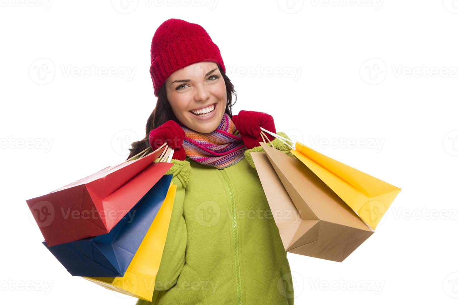 Mixed Race Woman Wearing Hat and Gloves Holding Shopping Bags photo