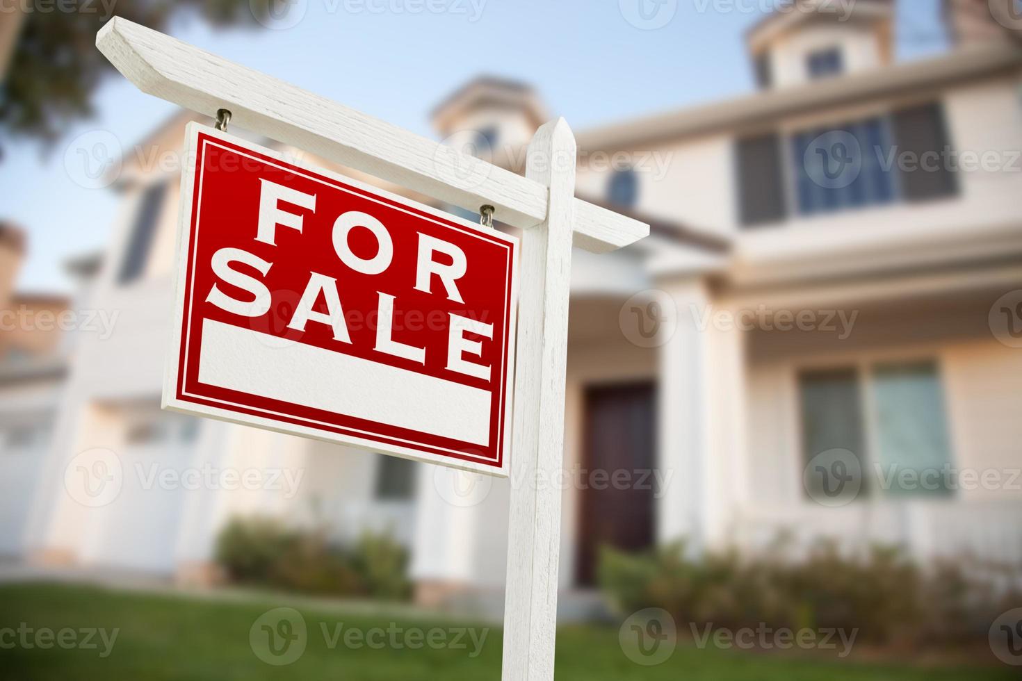 Home For Sale Real Estate Sign in Front of New House photo