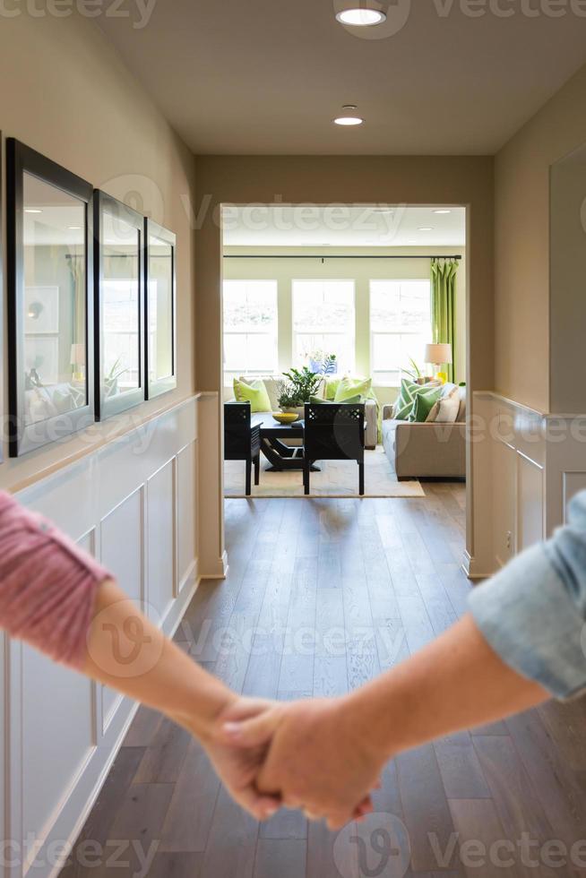 Couple holding hands. New home owners photo