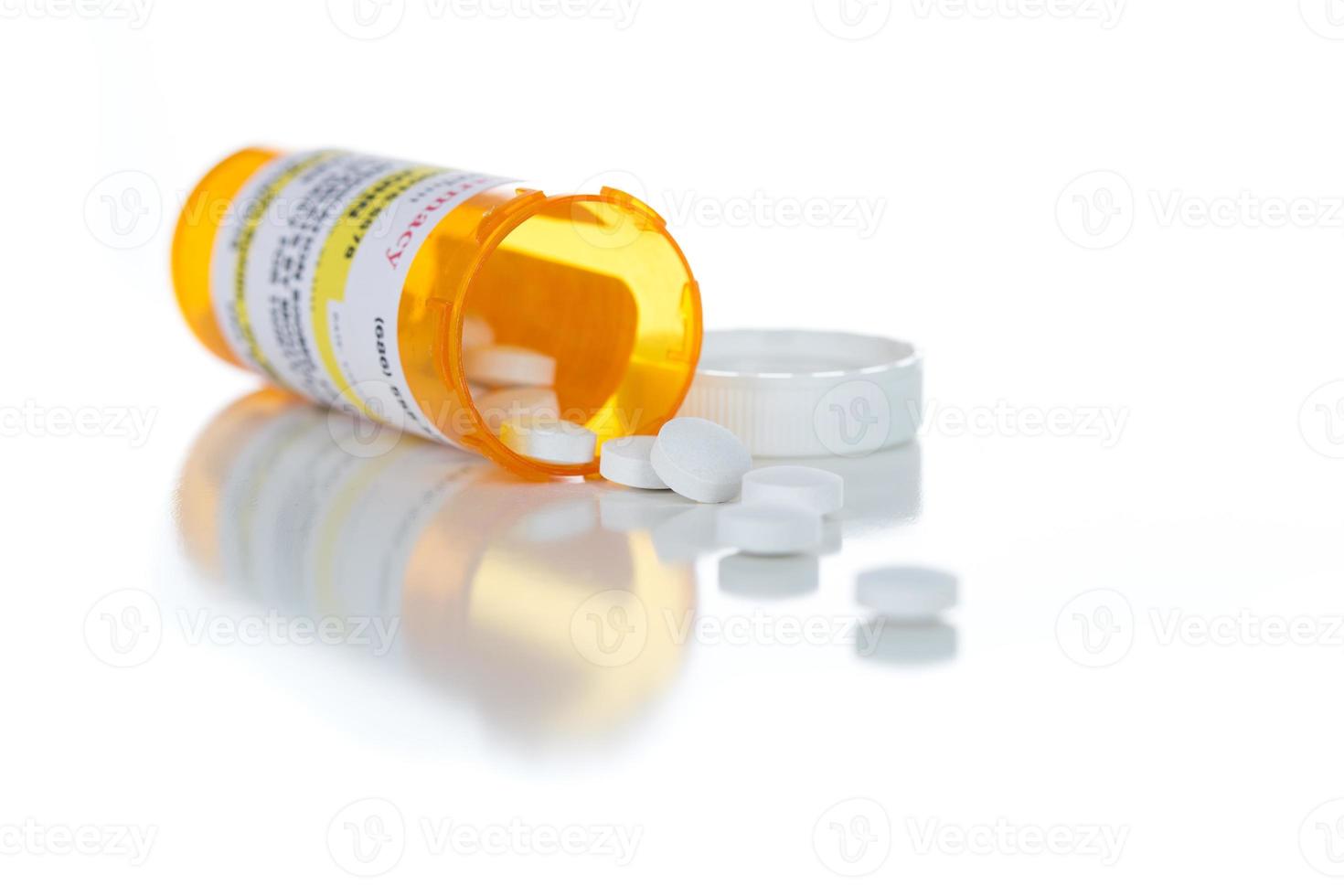 Non-Proprietary Medicine Prescription Bottle and Spilled Pills Isolated on White photo