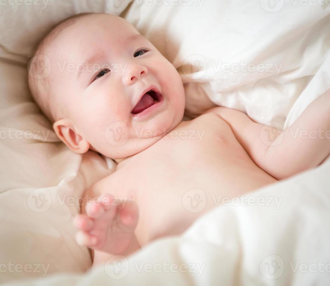 Mixed Race Baby Boy Having Fun on His Blanket photo