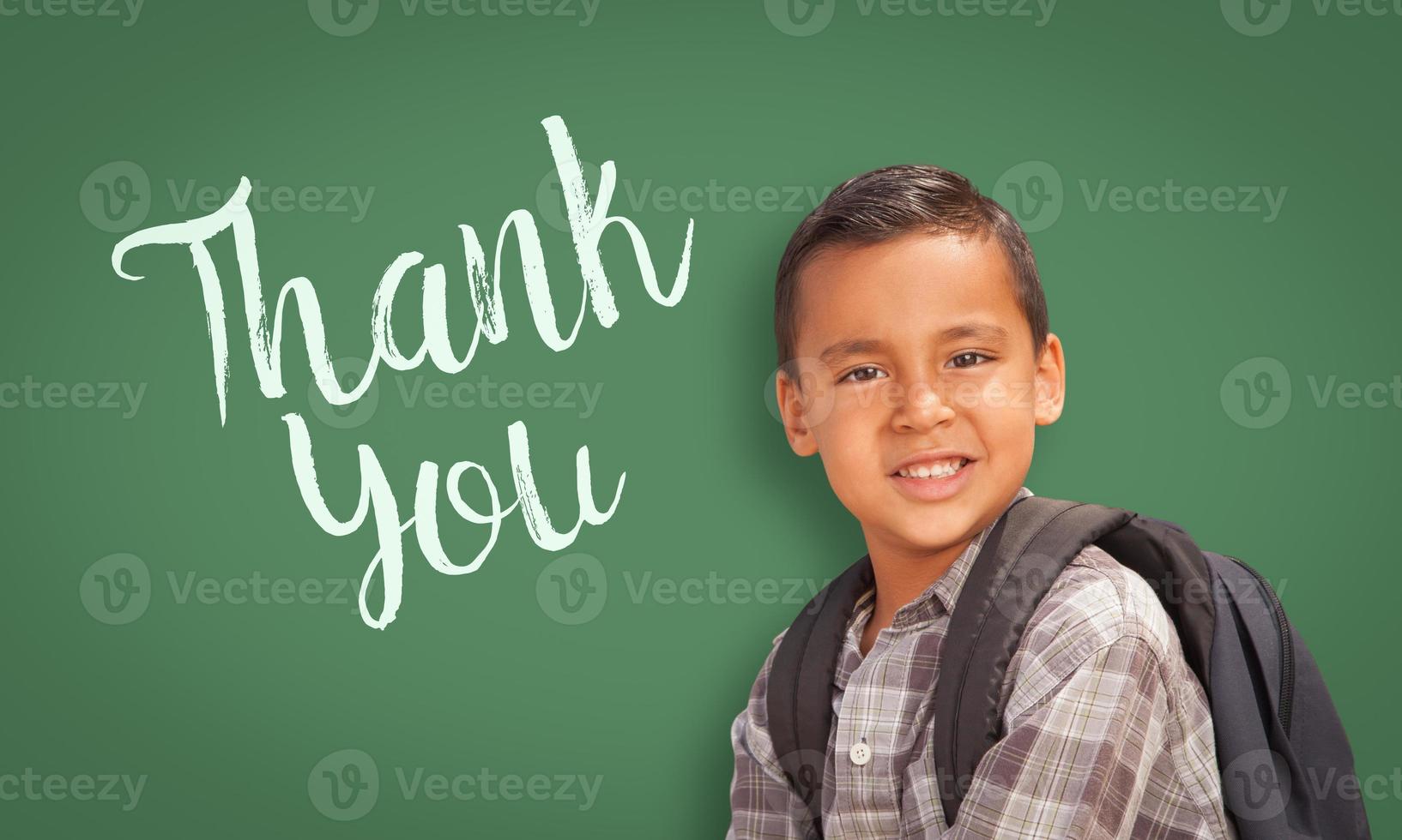 Hispanic Boy in Front of Chalk Board with Thank You Written On It photo