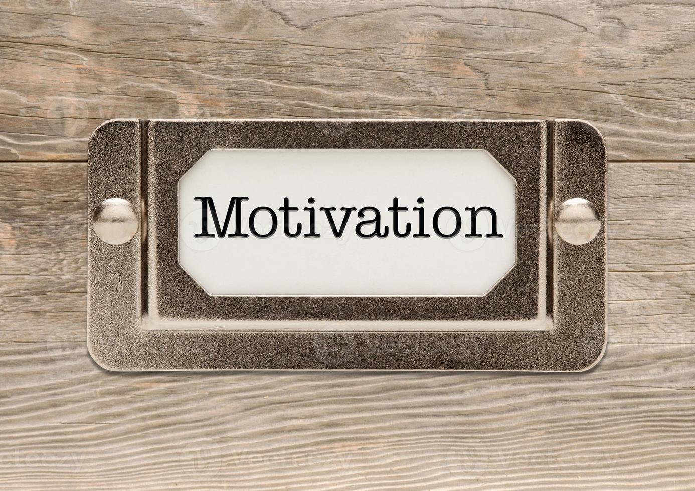 Motivation Metal File Cabinet Label Frame on Wood photo